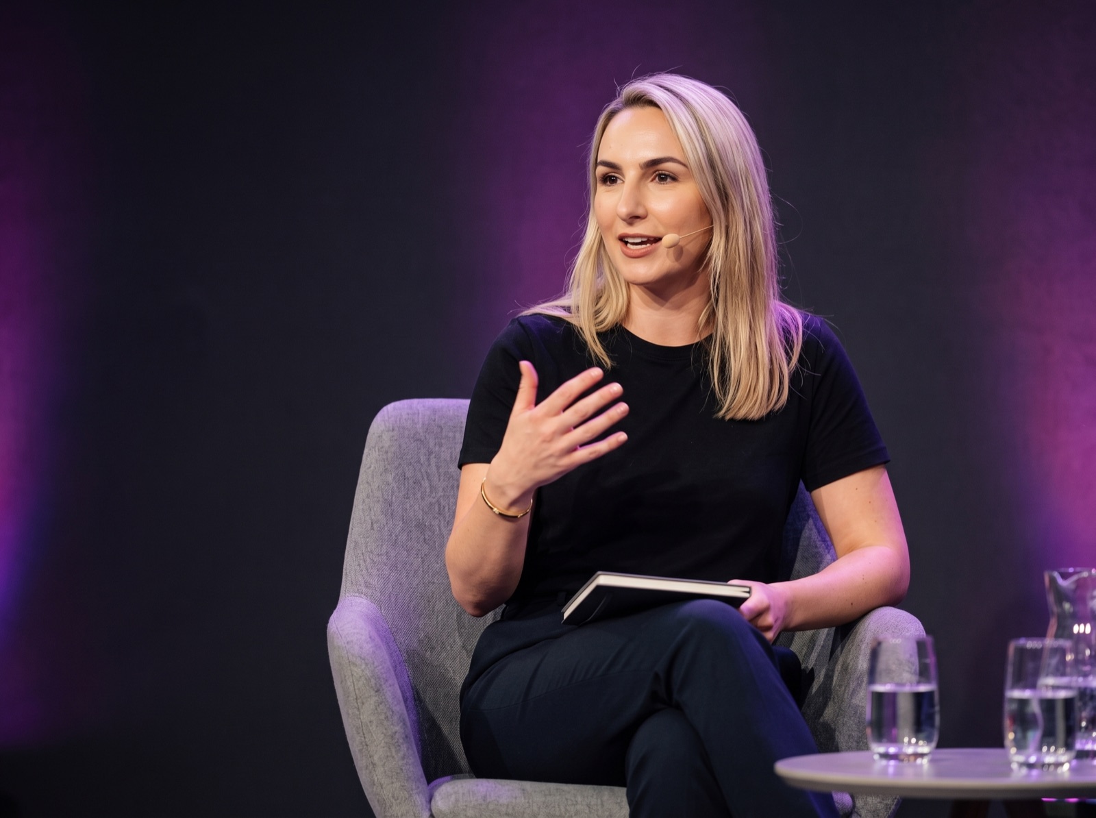 Katelin O'Shea speaking on stage at an event